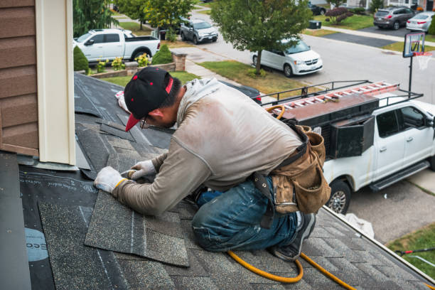Professional Roofing technician working in West Alton, MO